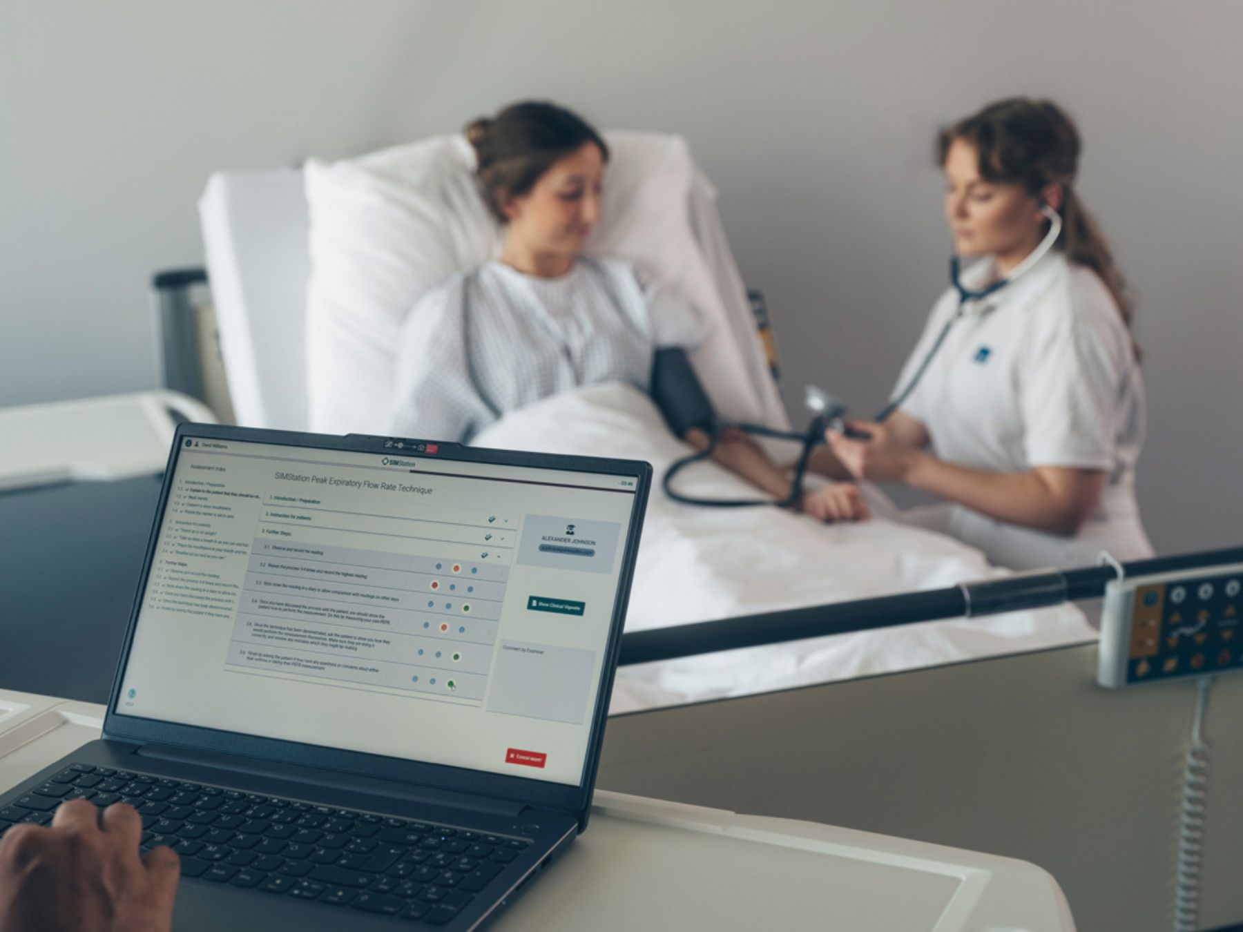 Two students during an OSCE exam, with performance being evaluated in real time.